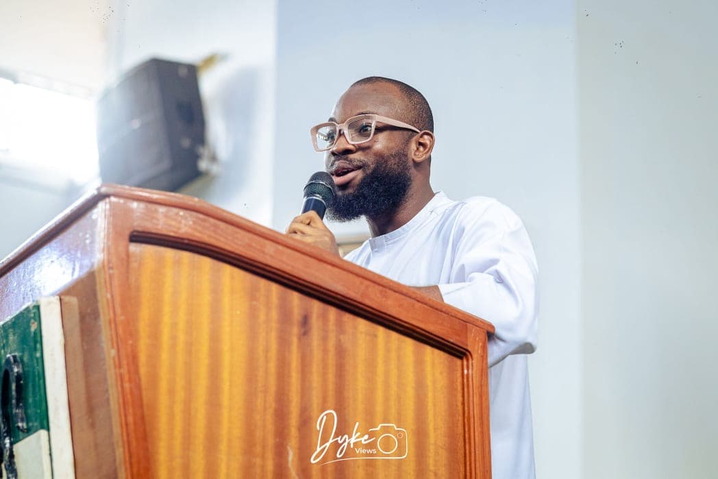 David Ejere delivering a keynote from the podium
