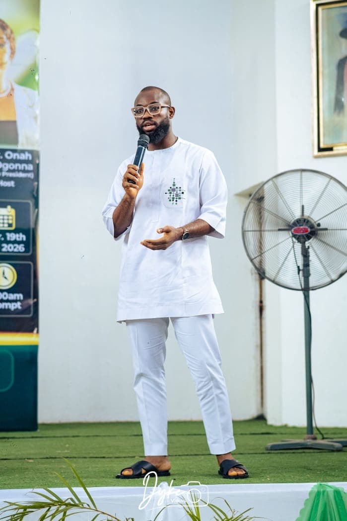 David Ejere on stage, engaging the room